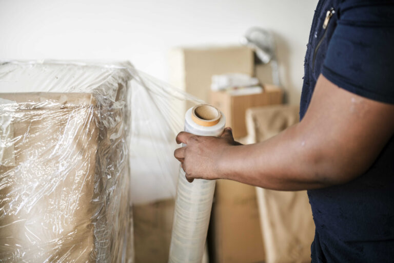 black-man-moving-furniture-1-1-scaled